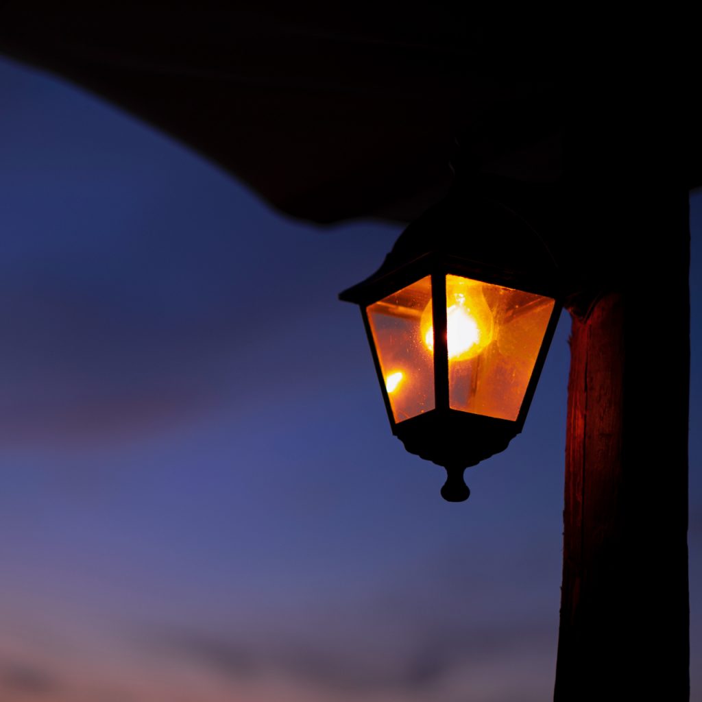 A photo of a porch light at night