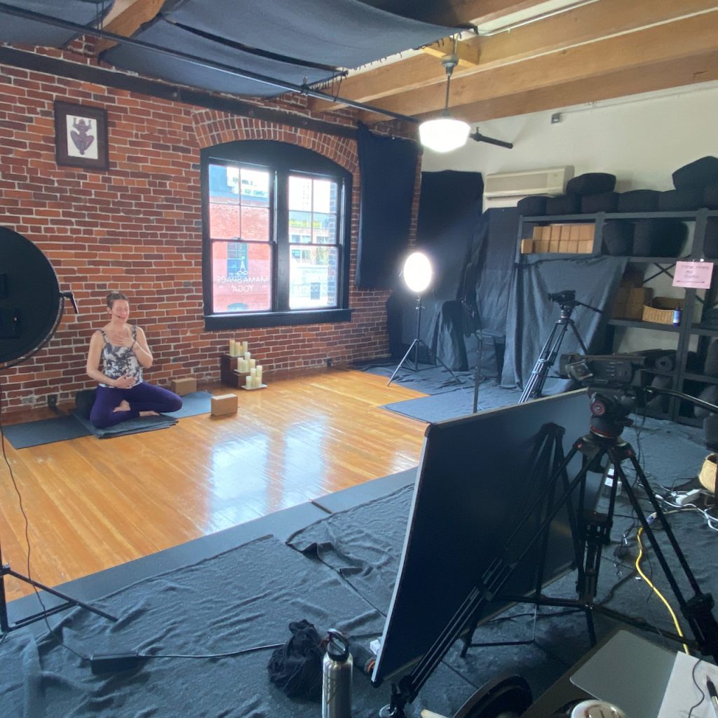 A behind the scenes photo of how we use blankets to enhance the sound quaity of our yoga videos