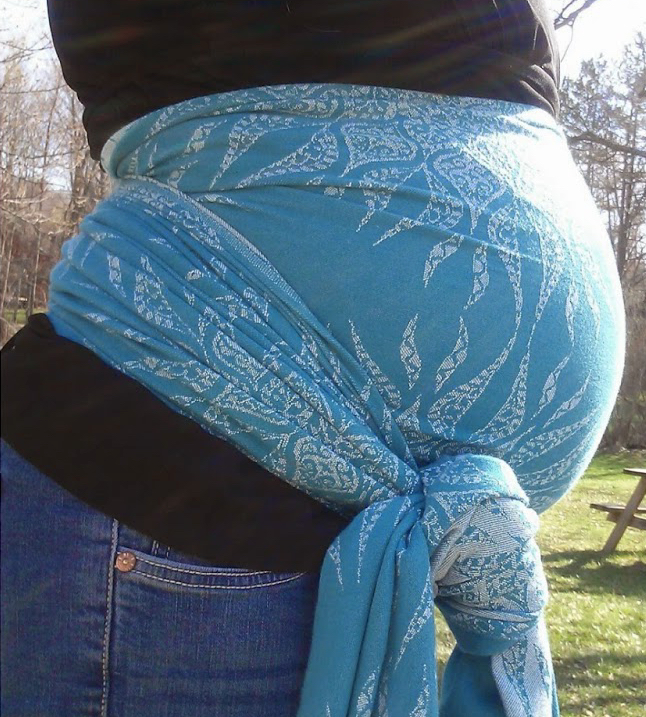 A photo of a belly lifter worn by a pregnant woman. The belly lifter is made from a piece of cloth