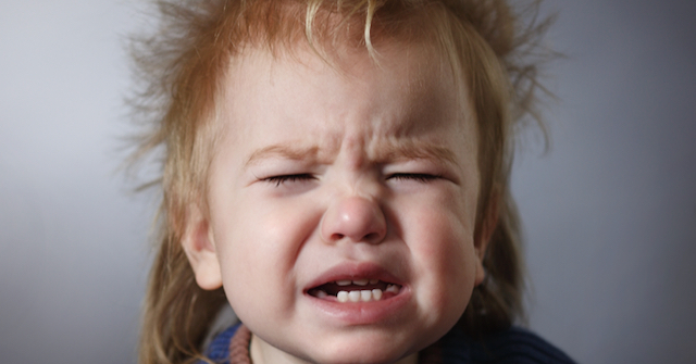 A photo of a crying toddler