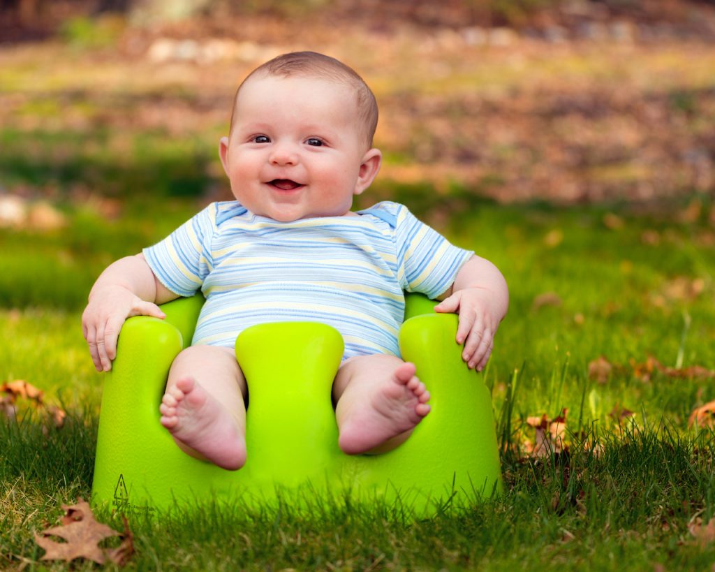 A photo of a baby in a Bumbo Seat